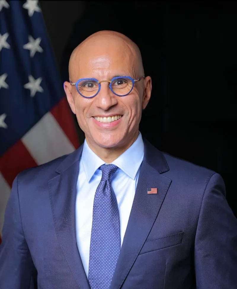 Portrait of George Farag in front of the American flag